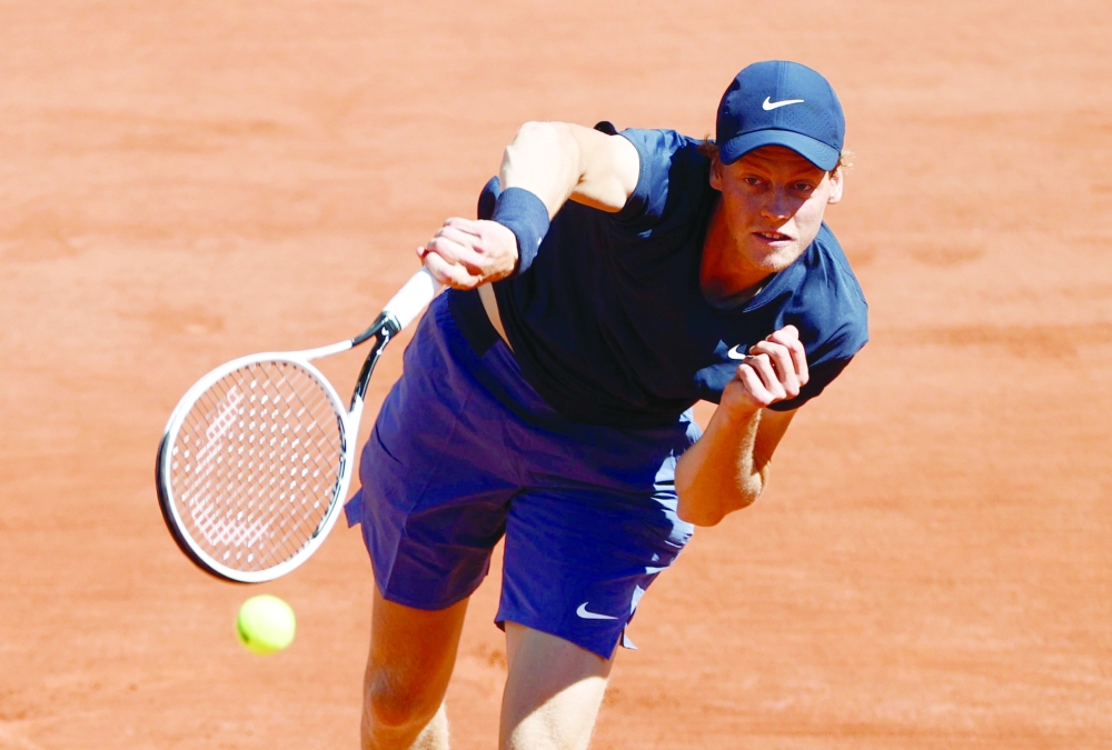 Italy's Jannik Sinner in action during his first round match against France's Pierre-Hugues Herbert. -- Reuters