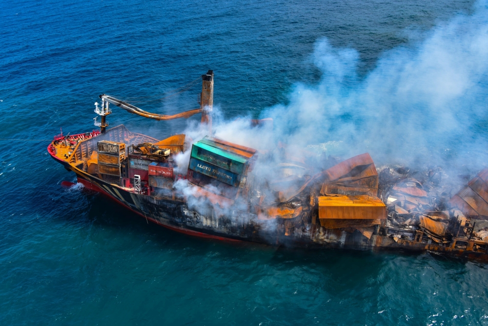 Smoke rises from a fire onboard the MV X-Press Pearl vessel as it sinks while being towed into deep sea off the Colombo Harbour, in Sri Lanka June 2, 2021. Sri Lanka Airforce Media/Handout via REUTERS 