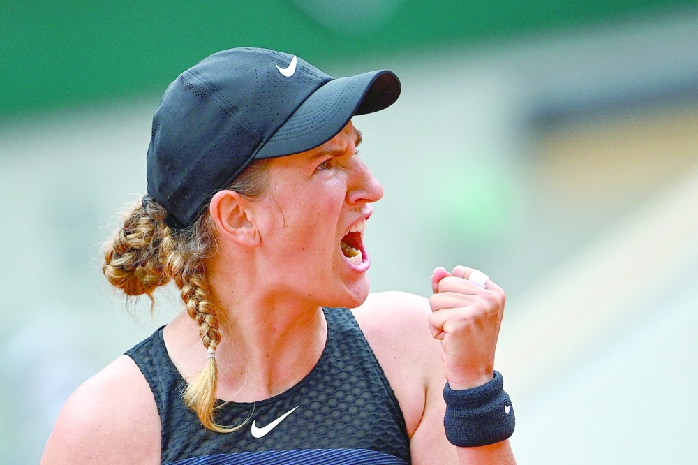 Belarus' Victoria Azarenka reacts after winning a point against Madison Keys of the US. -- AFP