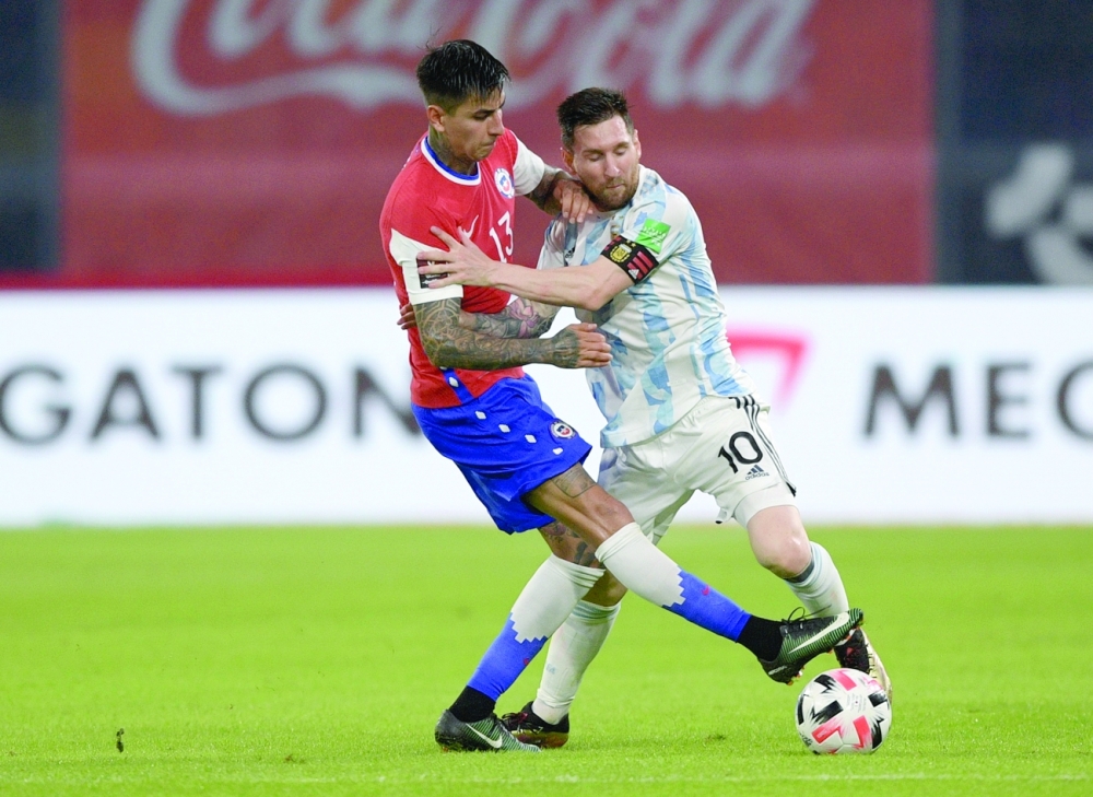 Argentina's Lionel Messi in action with Chile's Erick Pulgar. --- Reuters