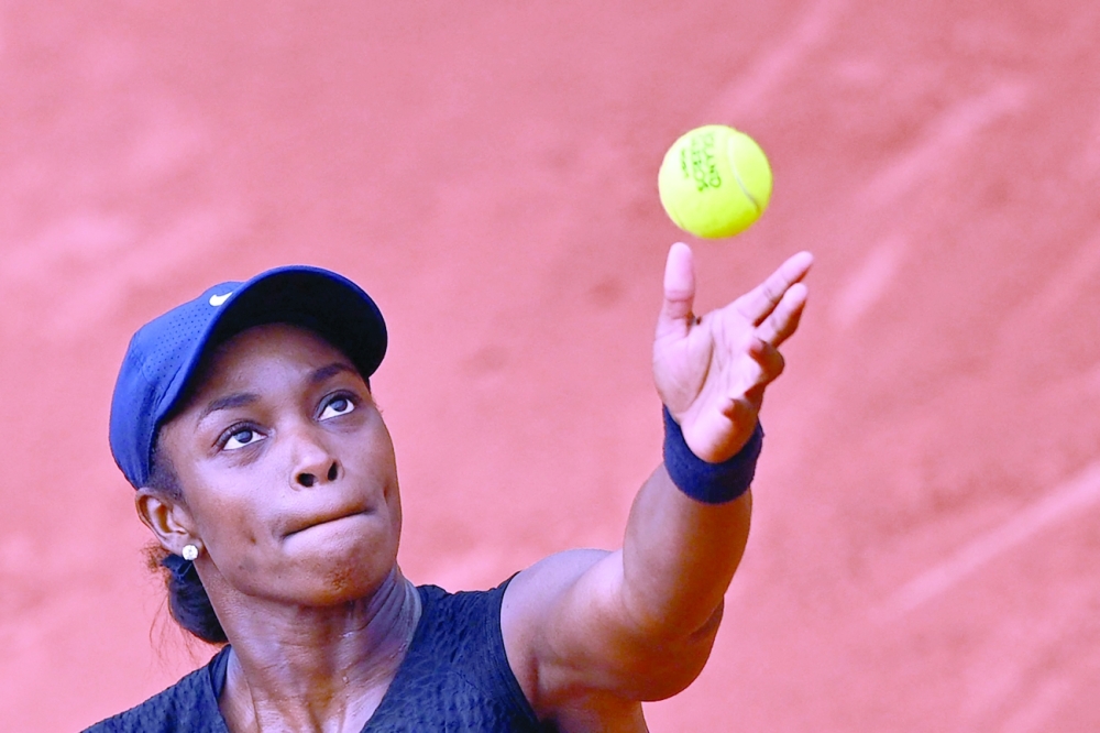 Sloane Stephens eyes the ball as she serves the ball to Karolina Muchova during their women's singles third round match. -- AFP