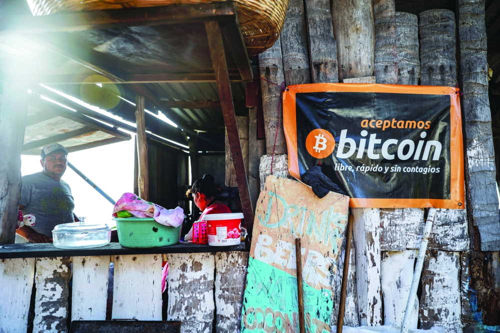 A banner that reads "We accept Bitcoin, free, fast and without contagion" is seen at a beach cafe on Punta Roca Beach in La Libertad, El Salvador. — Reuters file photo
