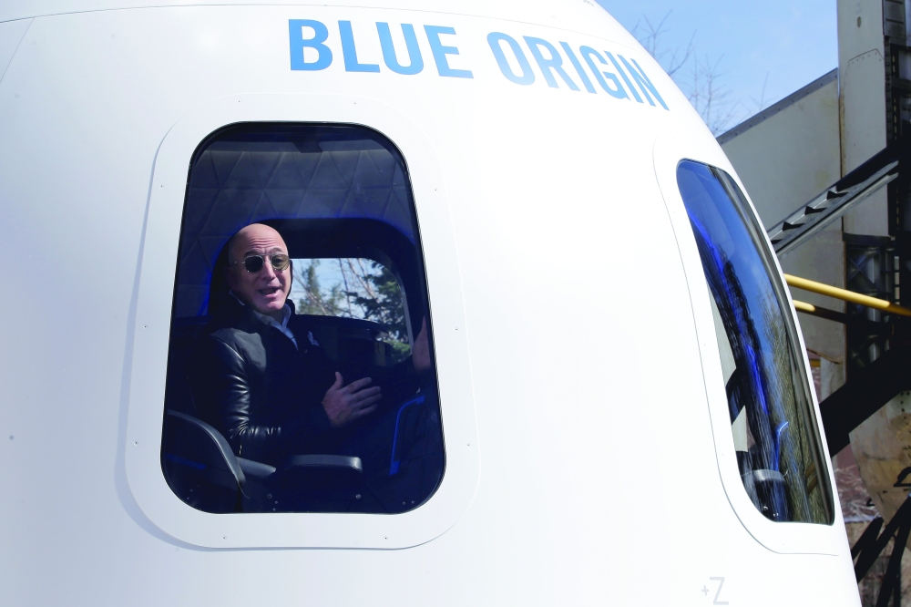 Jeff Bezos addresses the media about the New Shepard rocket booster and Crew Capsule mockup at the 33rd Space Symposium in Colorado Springs, Colorado.  Reuters file photo