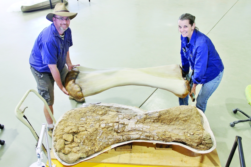 Dr Scott Hocknull and Robyn Mackenzie pose with a 3D reconstruction and the humerus bone of "Cooper," a new species of dinosaur discovered in Queensland. — Reuters 