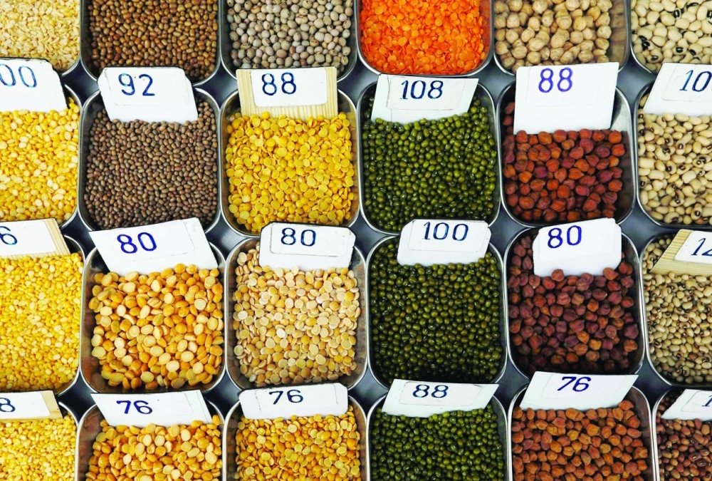 Price tags are seen on the samples of pulses that are kept on display for sale at a market in Mumbai. — Reuters file photo