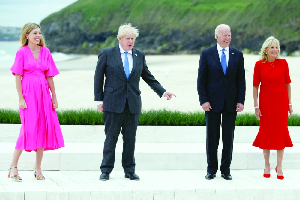 US President Joe Biden and First Lady Jill Biden pose with Britain's Prime Minister Boris Johnson and his wife Carrie Johnson at the G7 summit in Carbis Bay, Cornwall, south-west England.  - AFP
