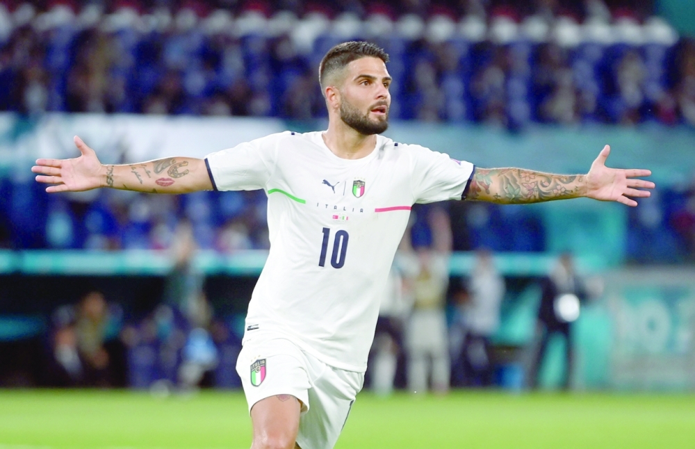 Italy's Lorenzo Insigne celebrates scoring their third goal. --Reuters