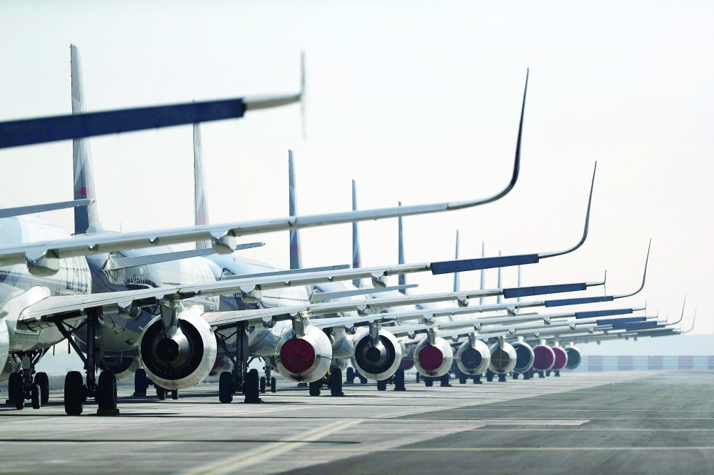 Passenger planes parked on a runway are seen at the Arturo Merino Benitez International Airport, in Santiago, Chile. — Reuters