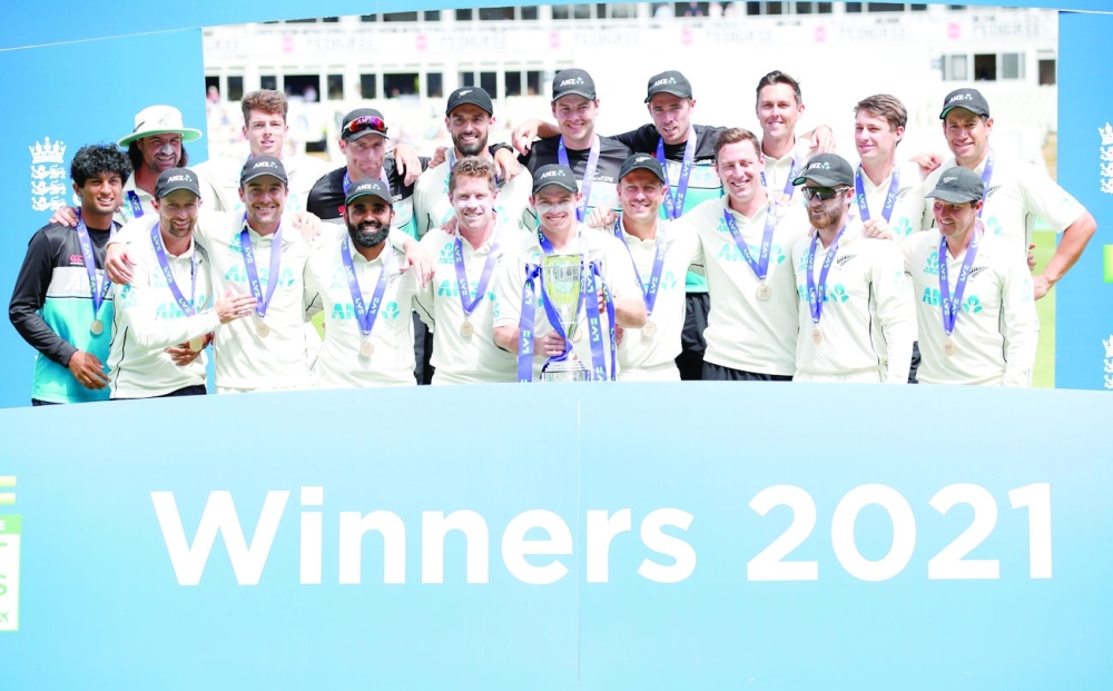 Cricket - Second Test - England v New Zealand - Edgbaston Stadium, Birmingham, Britain - June 13, 2021 New Zealand's Tom Latham celebrates winning the series with the trophy and teammates Action Images via Reuters/Peter Cziborra
