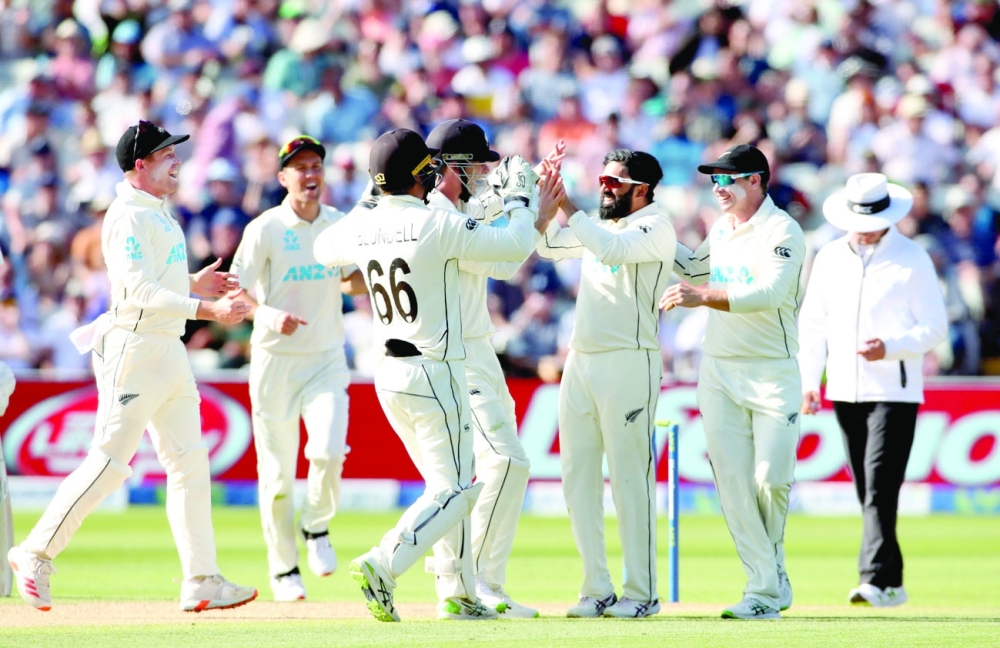 Cricket - Second Test - England v New Zealand - Edgbaston Stadium, Birmingham, Britain - June 12, 2021 New Zealand's Ajaz Patel celebrates with teammates after taking the wicket of England's Joe Root Action Images via Reuters/Peter Cziborra
