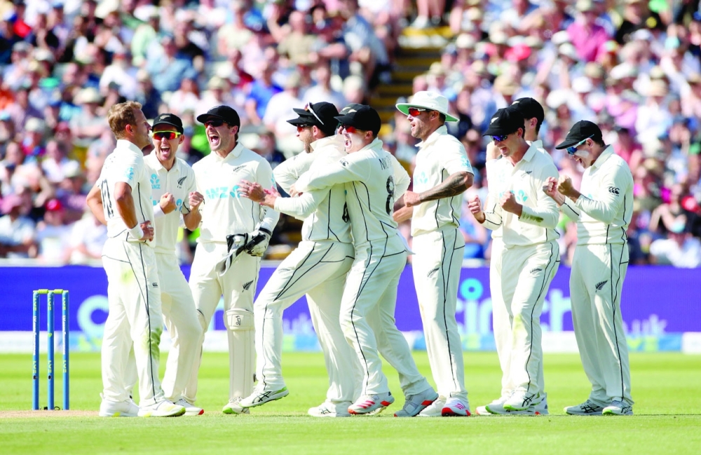 Cricket - Second Test - England v New Zealand - Edgbaston Stadium, Birmingham, Britain - June 12, 2021 New Zealand's Neil Wagner celebrates with teammates after taking the wicket of England's Ollie Pope Action Images via Reuters/Peter Cziborra
