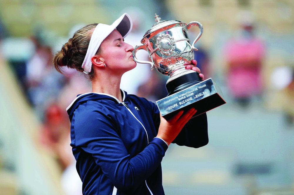 Tennis - French Open - Roland Garros, Paris, France - June 12, 2021 Czech Republic's Barbora Krejcikova celebrates with the trophy after winning the final match against Russia's Anastasia Pavlyuchenkova REUTERS/Sarah Meyssonnier     TPX IMAGES OF THE DAY