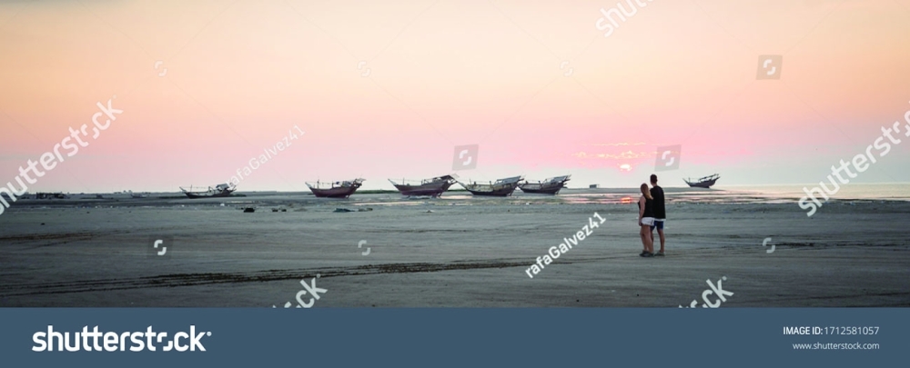stock-photo-masirah-island-oman-december-beautiful-panoramic-image-of-a-loving-couple-taking-a-walk-1712581057