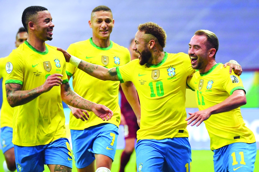 Brazil's Neymar (2nd R) celebrates with teammates. -- AFP