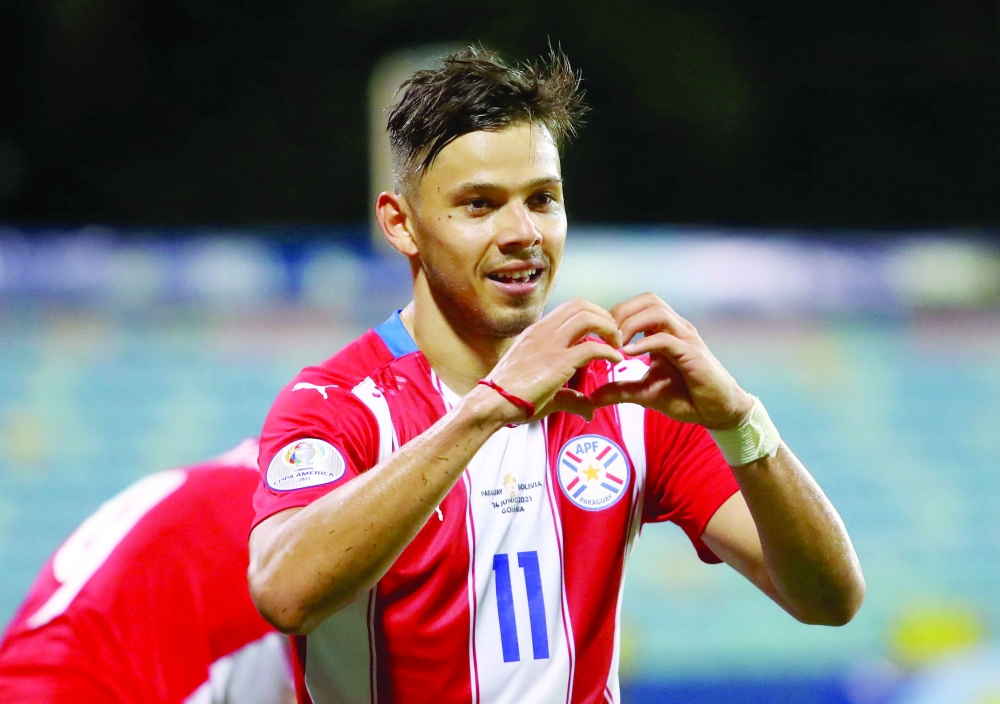 Paraguay's Angel Romero celebrates scoring their third goal. -- Reuters