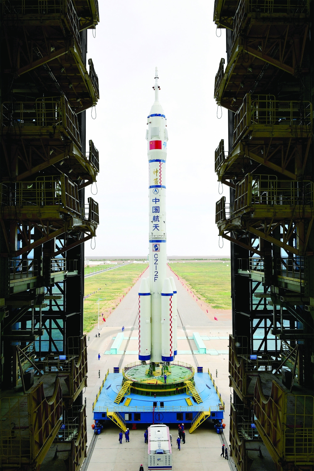 The Long March-2F Y12 rocket carrying the Shenzhou-12 spacecraft is transferred to the launch pad at Jiuquan Satellite Launch Center in Gansu province. — Reuters