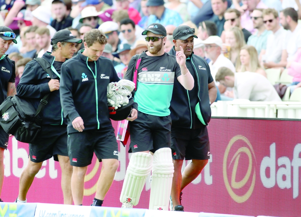 New Zealand’s Kane Williamson and BJ Watling walk by the pitch after being rested for the second Test against at Edgbaston. — Reuters