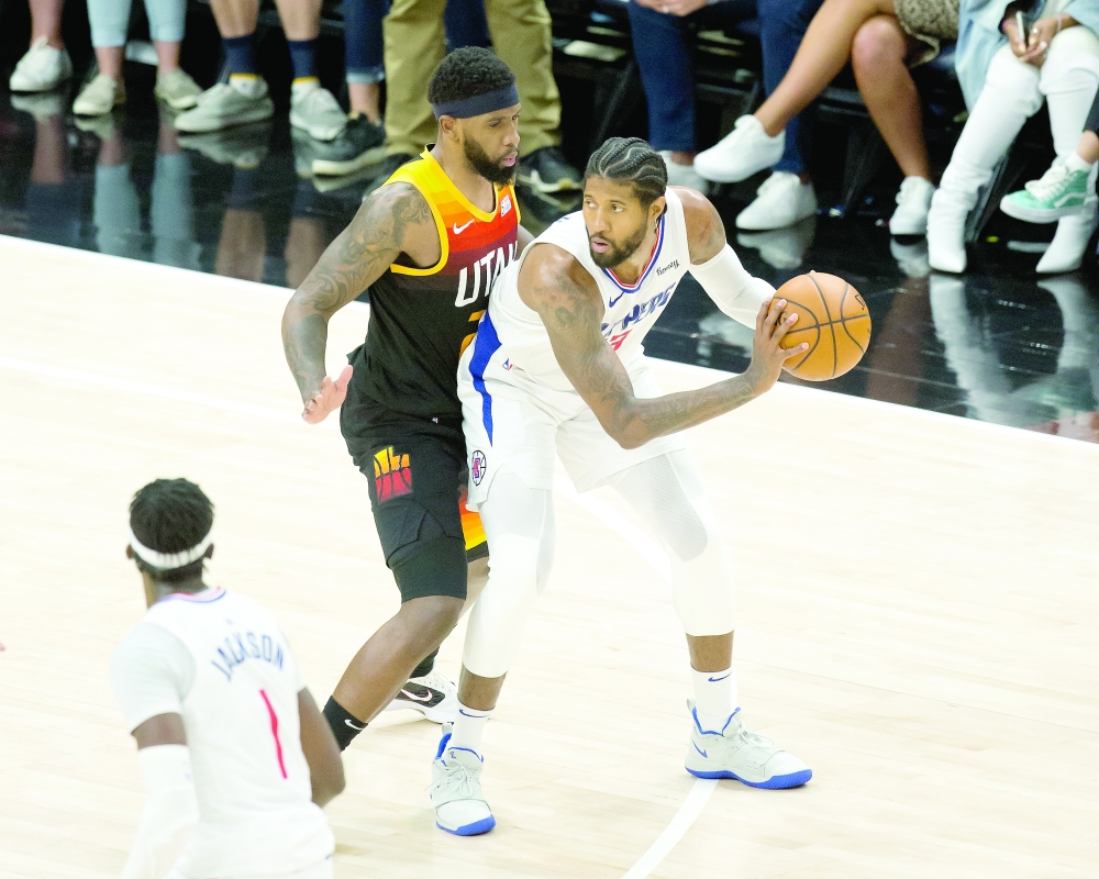 Utah Jazz's Royce O'Neale (23) defends against LA Clippers' Paul George (13) at Vivint Arena. -- USA Today Sports