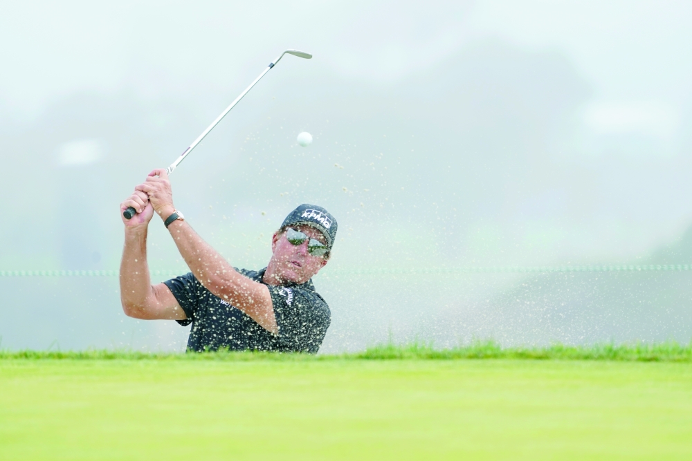 Phil Mickelson hits from a sand trap on the 12th green during a practice round of the US Open at Torrey Pines. -- USA Today Sports
