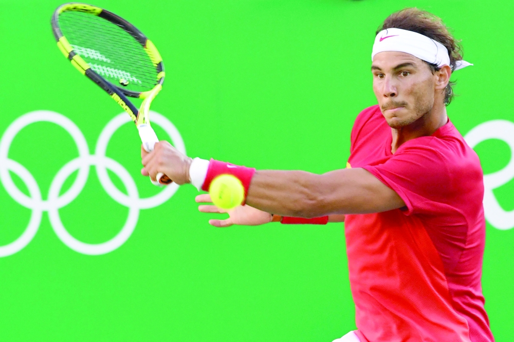 (FILES) In this file photo taken on August 13, 2016 Spain's Rafael Nadal returns the ball to Argentina's Juan Martin Del Potro during their men's singles semi-final tennis match at the Olympic Tennis Centre of the Rio 2016 Olympic Games in Rio de Janeiro. Rafael Nadal has announced, June 17, he will not be playing at Wimbledon or the Olympic Games this year. - XGTY
 / AFP / Luis Acosta / XGTY

