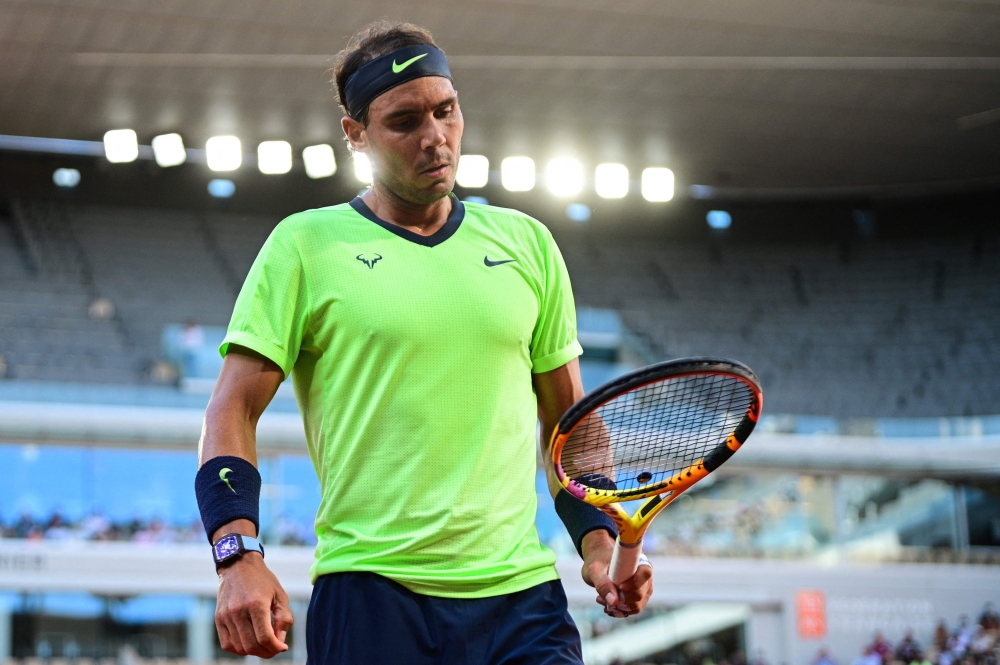 Spain's Rafael Nadal reacts during his men's singles semifinal against Serbia's Novak Djokovic on Day 13 of The Roland Garros 2021 French Open tennis tournament in Paris. -- AFP