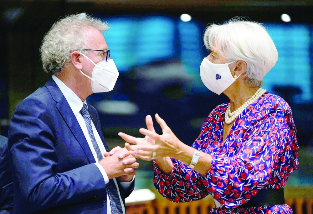 European Central Bank President Christine Lagarde talks to Luxembourg Finance Minister Pierre Gramegna during a meeting of Eurogroup Finance Ministers at the European Council building in Luxembourg. - AFP 