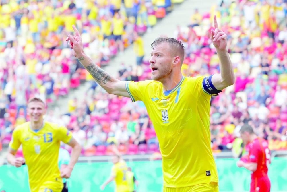Ukraine's Andriy Yarmolenko celebrates scoring their first goal. -- Reuters