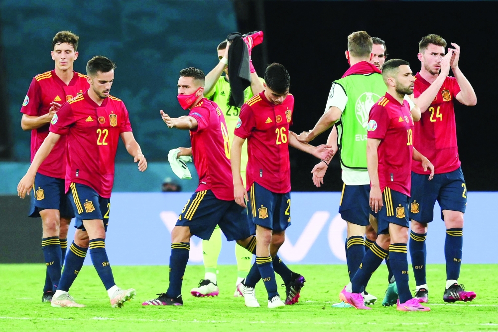 Spain's players react at the end of the UEFA Euro 2020 Group E match against Poland. -- AFP