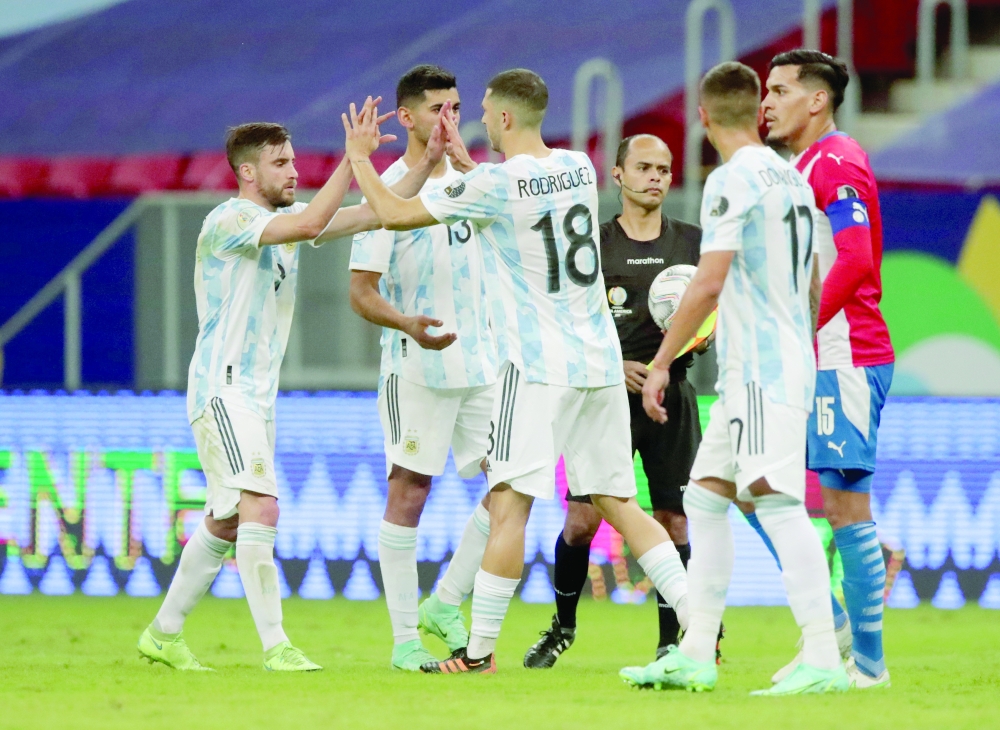 Argentina players celebrate after the match. -- Reuters