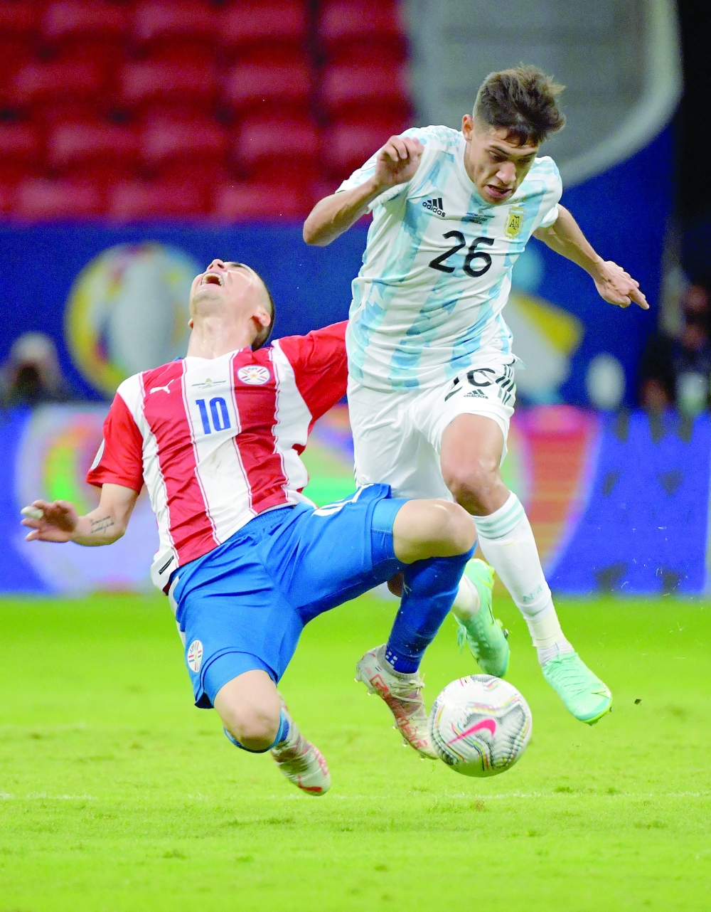 Paraguay's Miguel Almiron (L) and Argentina's Nahuel Molina vie for the ball. -- AFP 