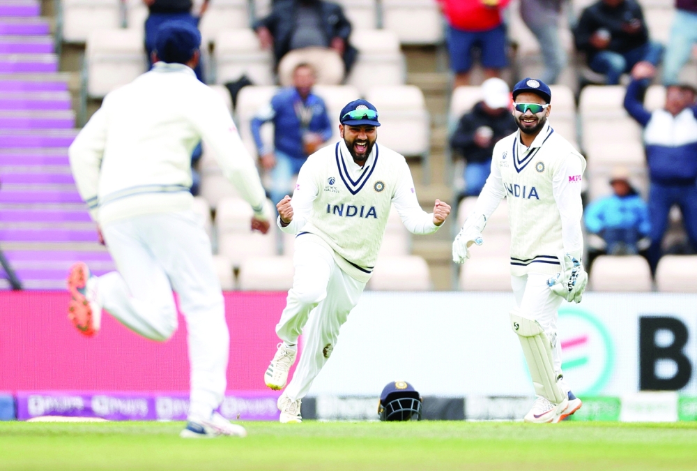 India's Rohit Sharma celebrates taking a catch to dismiss New Zealand's Henry Nicholls off the bowling of Ishant Sharma. -- Reuters