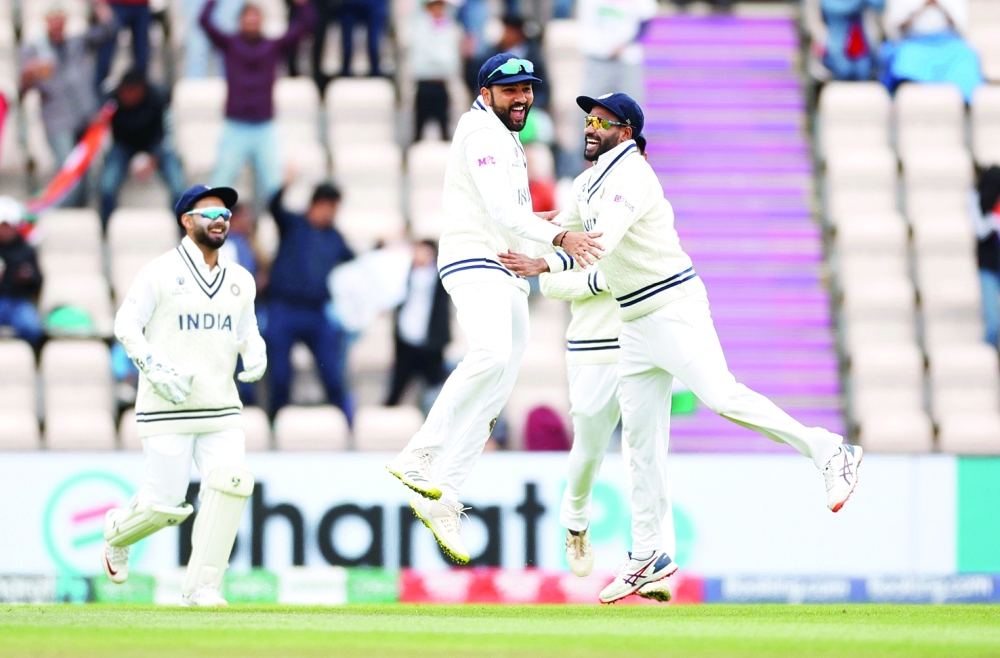 India's Rohit Sharma celebrates taking a catch to dismiss New Zealand's Henry Nicholls off the bowling of Ishant Sharma. -- Reuters
