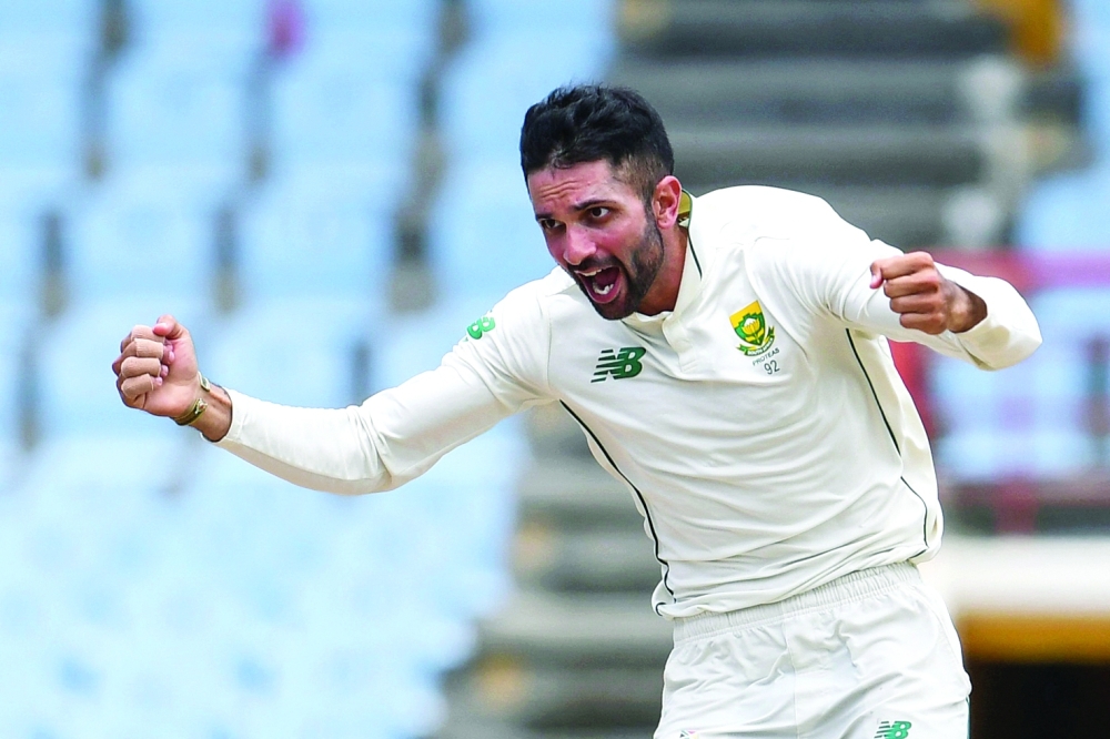 Keshav Maharaj of South Africa celebrates the dismissal of Jason Holder of West Indies. -- AFP