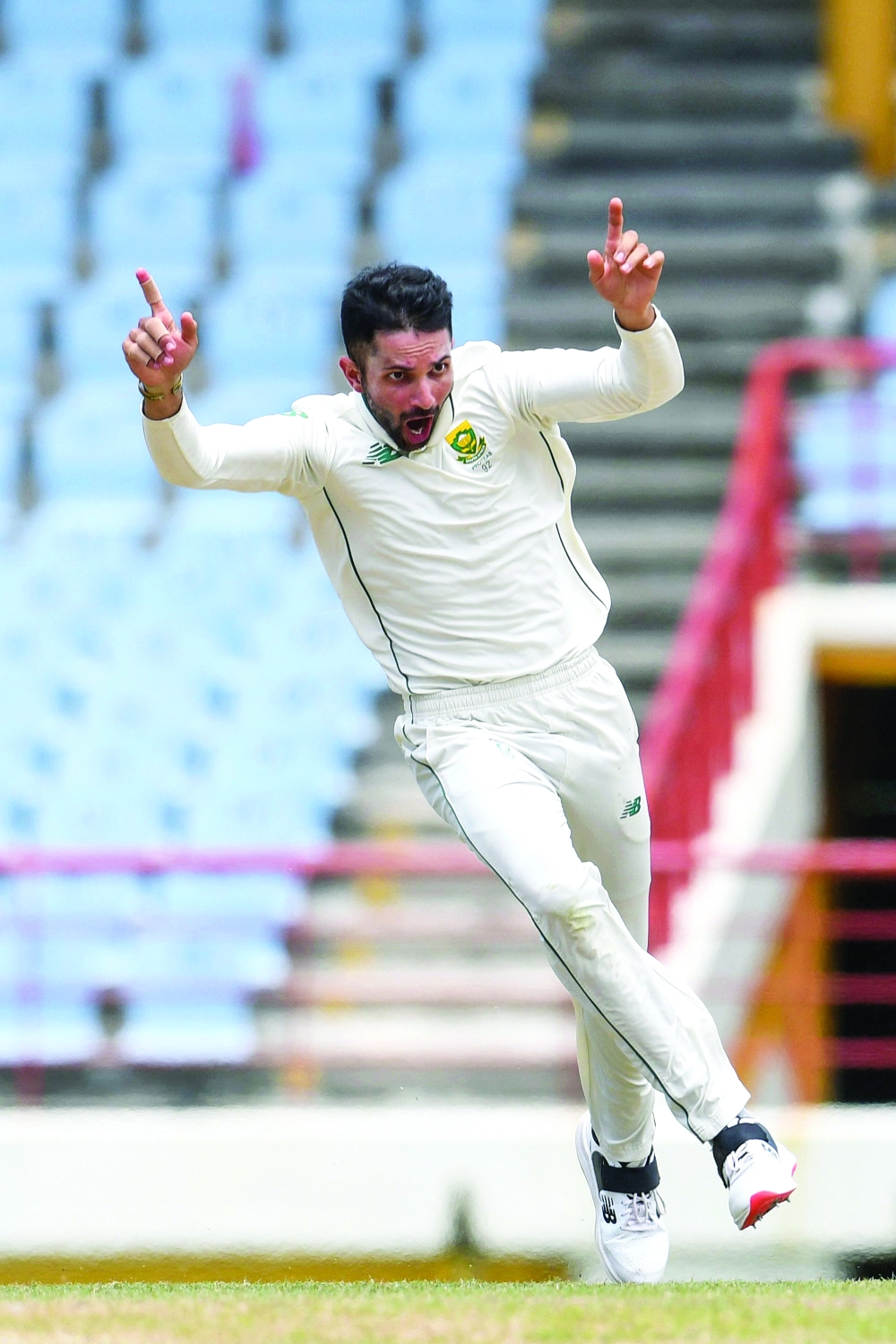 Keshav Maharaj of South Africa celebrates the dismissal of Jason Holder of West Indies. -- AFP