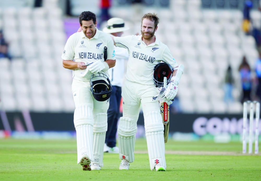 New Zealand's Kane Williamson and Ross Taylor celebrate after winning the ICC World Test Championship final. -- Reuters