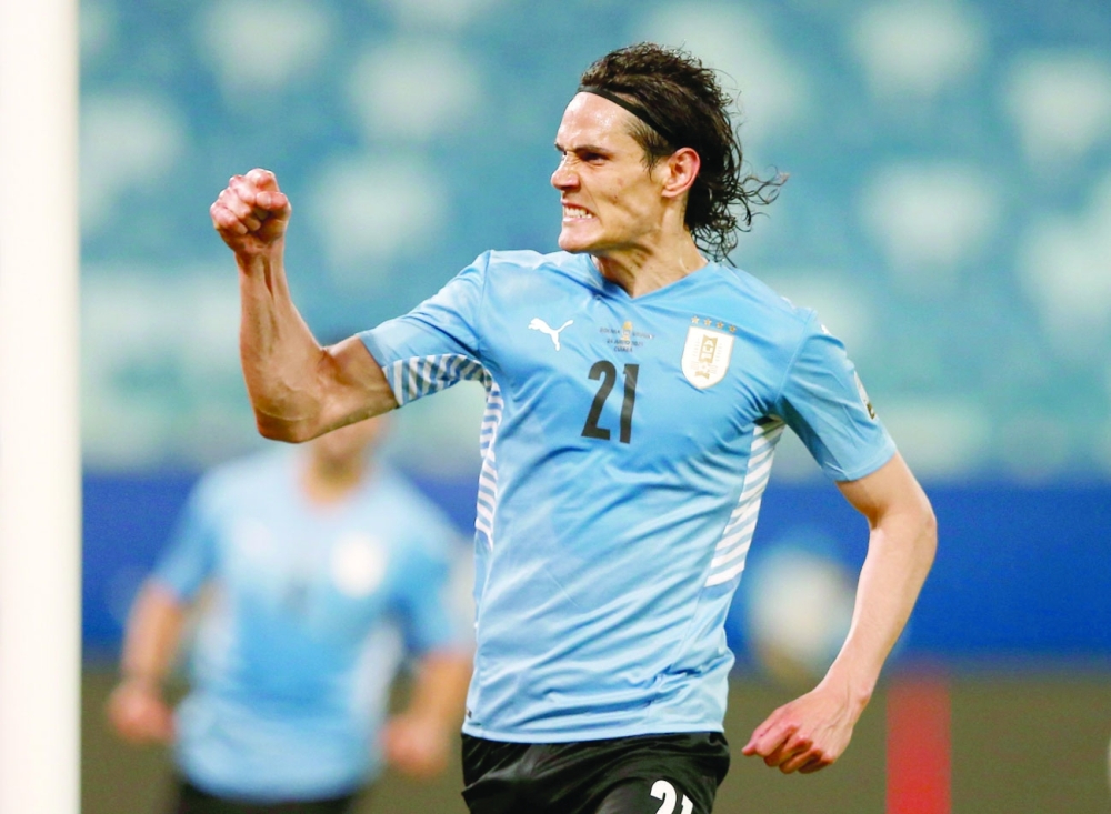 Uruguay's Edison Cavani celebrates scoring their second goal. -- Reuters