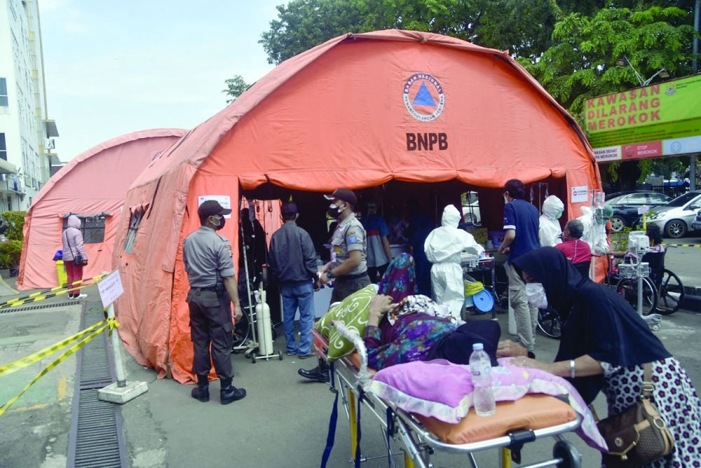 A makeshift tent is used to treat patients tested positive for coronavirus outside a hospital in Bekasi as new Covid infections soar in Indonesia. -  AFP 
