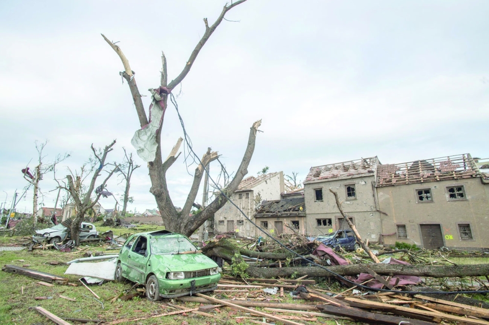 Destroyed trees and debris of damaged buildings are seen in the village of Mikulcice, Czech Republic, after it was hit by a tornado. - AFP 