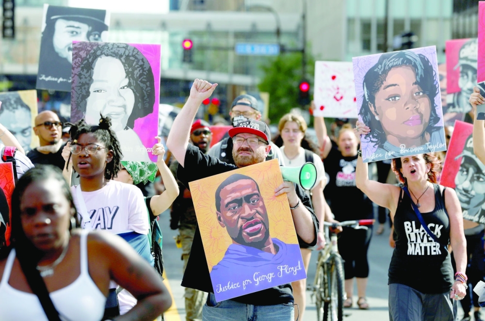 Protesters march during a rally after the sentencing of Derek Chauvin, the former Minneapolis policeman found guilty of killing George Floyd, in Minnesota. - Reuters