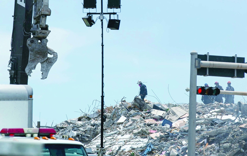 Rescue personnel continue to search the rubble at the site of a collapsed building in Surfside, Florida, north of Miami Beach, on Sunday.  AFP