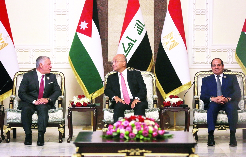 Iraqi President Barhah Saleh receives his Egyptian counterpart Abdel Fattah al Sisi and Jordan’s King Abdullah II, in Baghdad. — AFP
