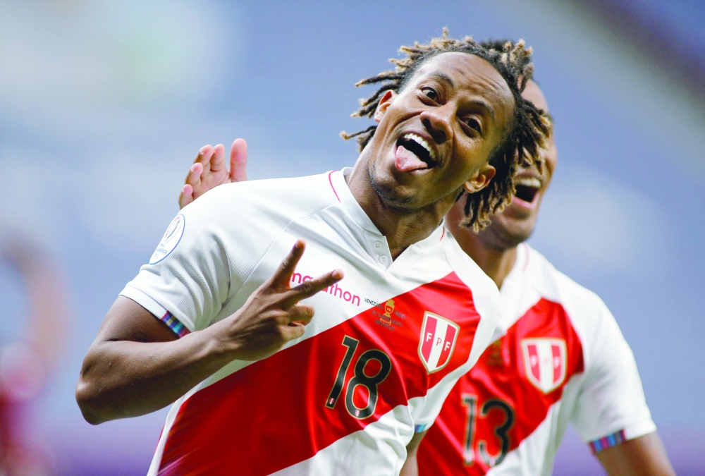 Peru's Andre Carrillo celebrates after scoring against Venezuela. -- AFP