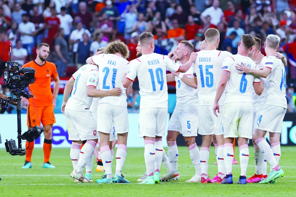 Czech Republic's players celebrate at the end of the UEFA EURO 2020 round of 16 match. -- AFP