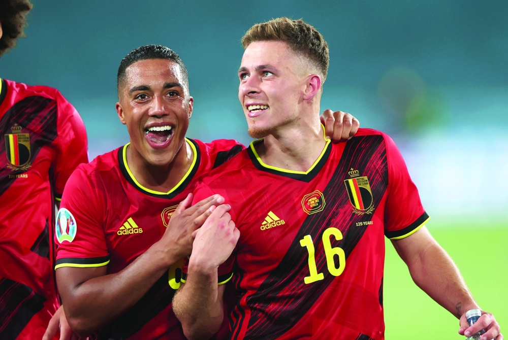 Belgium's Youri Tielemans and Thorgan Hazard celebrate after the match. -- Reuters