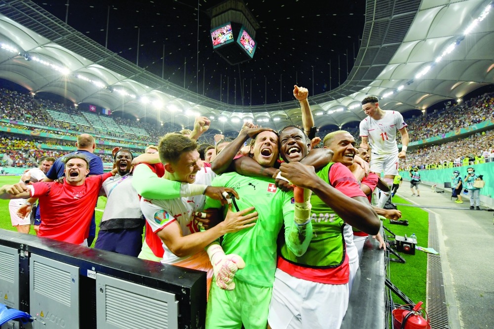 Switzerland's Yann Sommer celebrates after the match with teammates. -- Reuters
