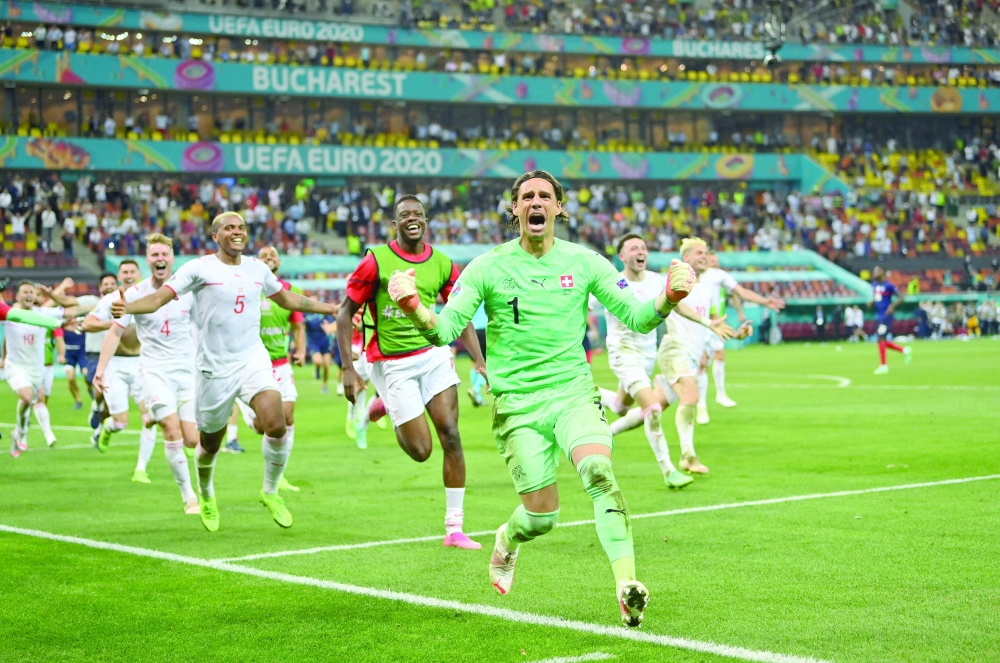 Switzerland's Yann Sommer celebrates after saving a penalty from France's Kylian Mbappe to win the shoot-out. -- Reuters