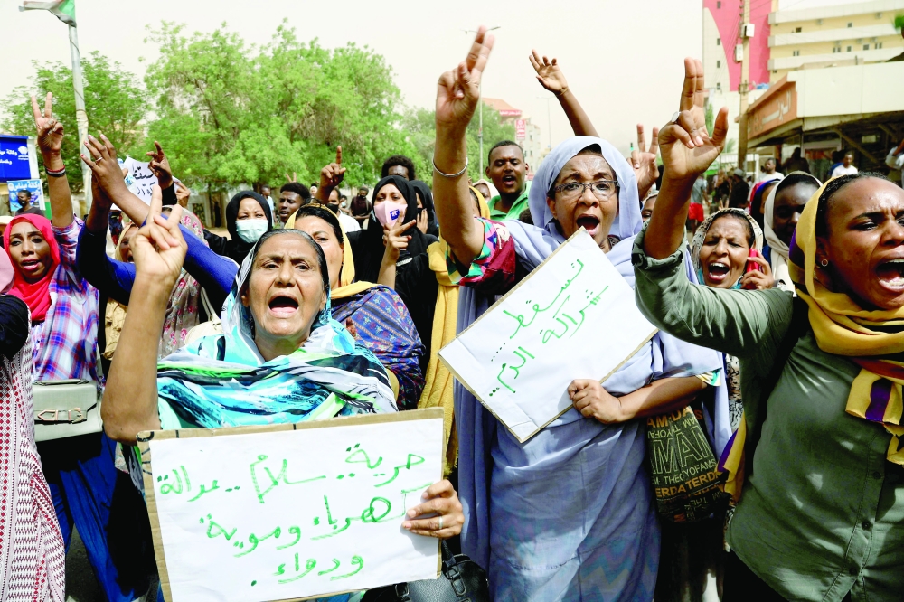 Sudanese protesters take part in a demonstration in the capital Khartoum on Wednesday, urging the government to step down over delayed justice and recent harsh economic reforms. - AFP 