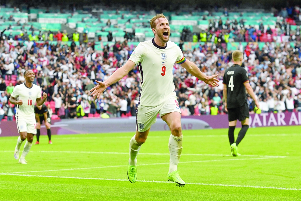 England's Harry Kane celebrates after scoring the second goal against Germany at Wembley Stadium in London. -- AFP