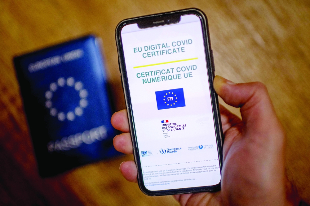A mobile phone whose screen bears a EU Digital Covid certificate. -- AFP