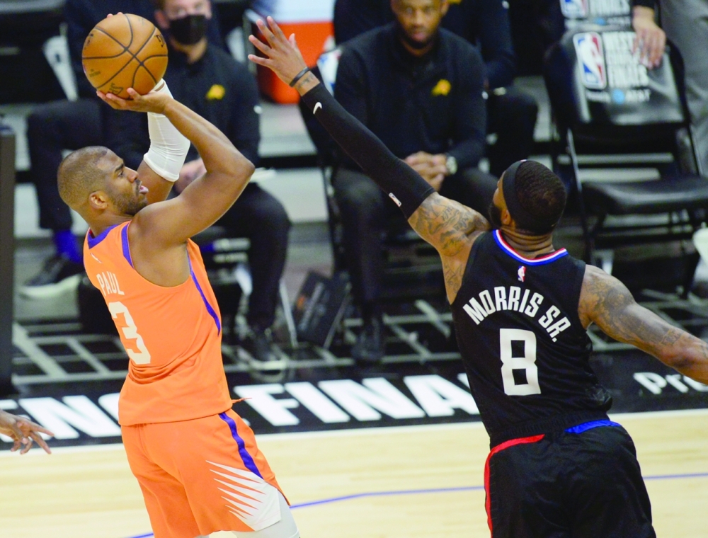 Phoenix Suns' Chris Paul (3) shoots against Los Angeles Clippers' Marcus Morris Sr (8) at Staples Center. -- USA Today Sports